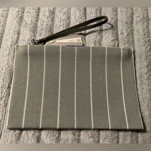 Rothy's The Wristlet pouch in the Maritime Cloud Stripe